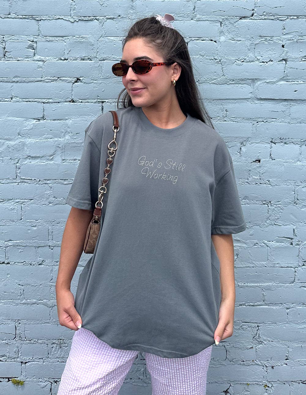 God's Still Working Unisex Tee